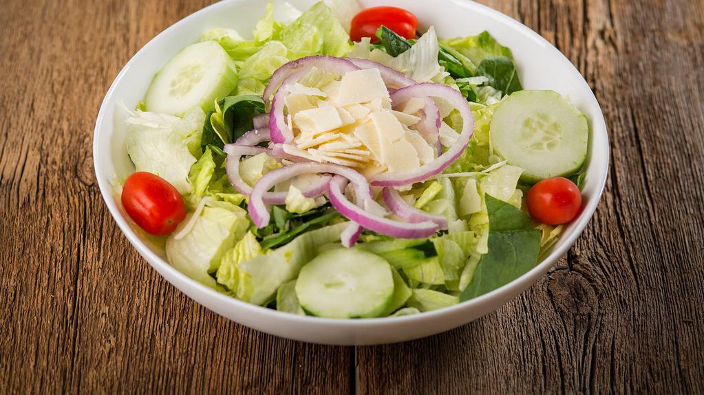 Side Salad · Romaine and iceberg lettuce, spinach leaves, cucumbers grape tomatoes, red onion, and shaved asiago cheese.