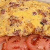 Farmers Omelette · Ham, Swiss cheese, onion, green pepper and hash browns wrapped inside served with tomato sli...