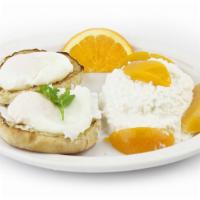 Matty'S Health Club · 2 poached eggs on a toasted English muffin with Cottage cheese and 2 peach halves. Served wi...
