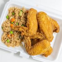 Fried Rice With Chicken Wings · Four piece chicken wings with fried rice.