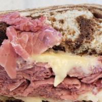 New Yorker Sandwich · Corned beef, swiss cheese, Russian dressing, and coleslaw on marble rye bread. Served with a...
