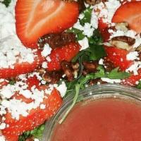 Flippin Berry Explosion Salad · Mixed greens, strawberries, pecans & feta cheese served with Flippin raspberry vinaigrette d...