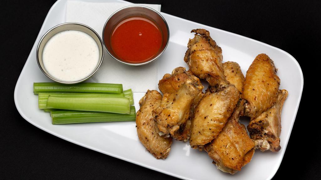 District Wings · Served with celery and your choice of ranch or bleu cheese dressing. Sauces served on the side or tossed. Picture shown: bone-in.