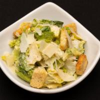 Side Caesar · Chopped romaine, garlic croutons and fresh parmesan with classic Caesar dressing.