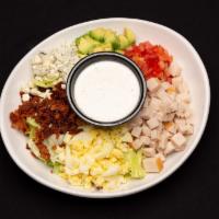 District Cobb · Romaine and iceberg lettuce mix with roasted turkey smoked bacon, bleu cheese crumbles, hard...