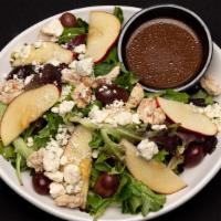 Apple Walnut · Field greens, red apple, red grapes, blue cheese and candied walnuts. Served with Dijon bals...