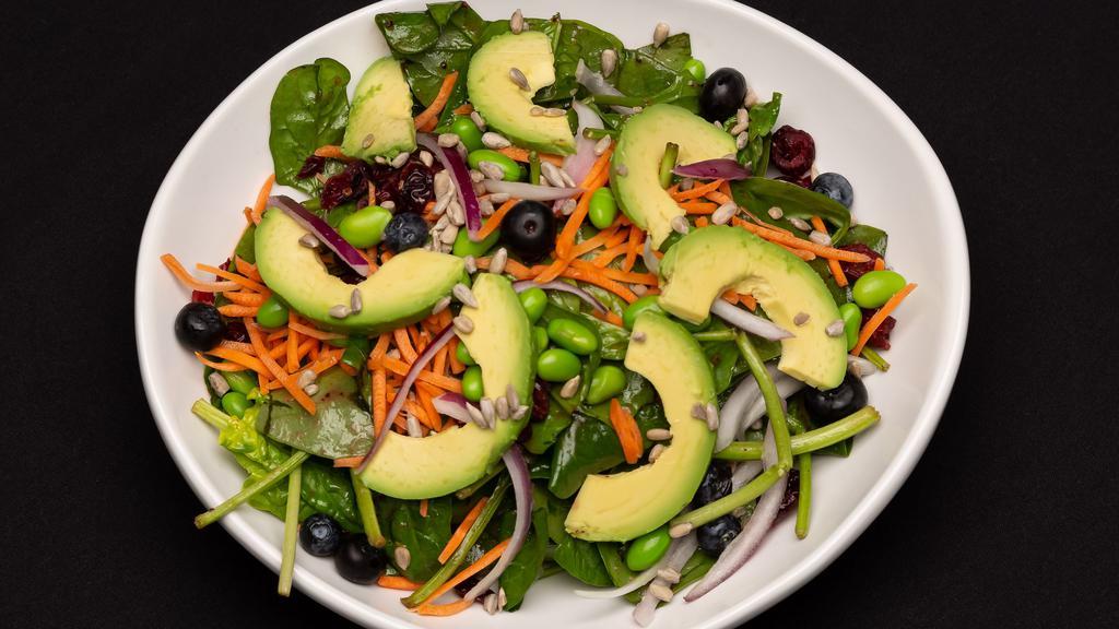 Super Food Spinach Salad · Baby spinach, blueberries, craisons, edamame, shredded carrots, diced red onion, avocado, and sunflower seeds tossed with raspberry walnut vinaigrette.