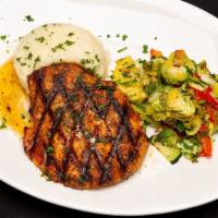 Grilled Salmon · Blackened salmon filet topped with lemon butter and served with mashed potatoes and seasonal...