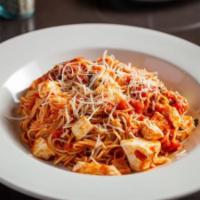 Capellini Pomodoro · Fresh Mozzarella, basil, marinara, and shredded Parmesan.