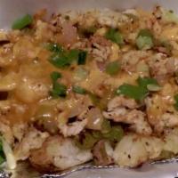 Smashed Potato #1 Specialty · Baked potato topped with your choice of meat , Grilled Green peppers and onions, Cheddar che...