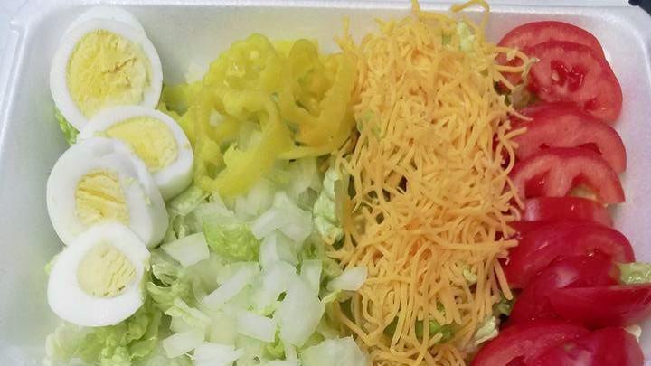 Garden Salad · Lettuce, tomato, cheese, onion, croutons and banana pepper.