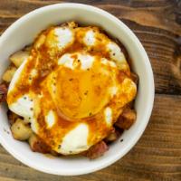 Breakfast Bowl · Roasted red potatoes, Lomah cheddar cheese crumbles, sunny side up egg, housemade chili sauce.