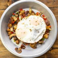 Vegetable Hash · Potatoes, bell peppers, onions, mushrooms, topped with two sunny sides up egg, housemade chi...