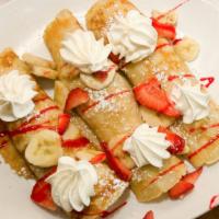 Banana Nutella Crepes · Delicately rolled house-made crepes, stuffed with chocolate hazelnut Nutella spread and fres...
