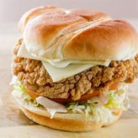 Tropical Spicy Chicken Sandwich · Crispy chicken breast seasoned with lemon pepper served with lettuce tomato Swiss American c...