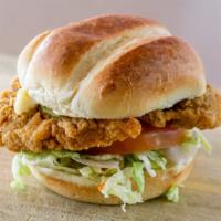Chicken Classic Sandwich · Crispy chicken breast served with lettuce, tomato, pickles & mayo on brioche bun.