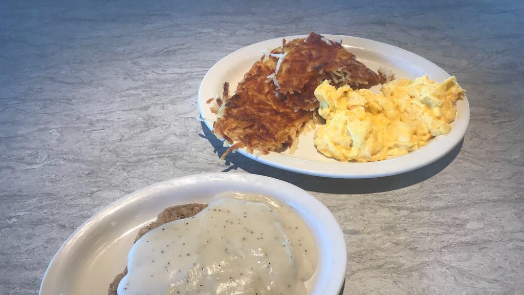 Country Fried Steak & Eggs · Tender beef steak lightly breaded, fried and topped with country-style pepper gravy. Served with hash browns and biscuits.