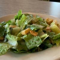 Caesar Salad · Romaine lettuce, parmesan cheese and croutons tossed in caesar dressing.