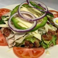 Clubhouse Salad · Topped with oven roasted turkey, chopped bacon, swiss cheese, hard-boiled egg, onions, green...