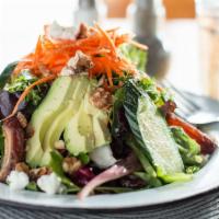 California Salad · Gluten-free. Vegetarian. Local greens, avocado, dates, raisins, carrots, cucumbers, goat che...