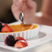 Crème Brulee · Classics vanilla custard with caramelized sugar and fresh berries