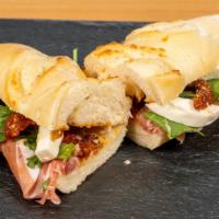 Italian Prosciutto Sandwich · Parmesan brioche; Italian prosciutto; Arugula; Sun-dried tomatoes; Fresh mozzarella; House m...