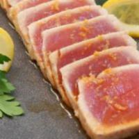 Tuna Tataki · slices of seared tuna topped w/ ponzu sauce, sesame seeds, scallions, masago