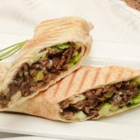 Beef Shawarma Dinner · Seasoned and marinated beef sirloin steak strips charbroiled on a vertical broiler.