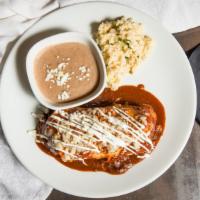 Burrito · Beef or chicken, onions, garlic, asadero and manchego cheese, red chile sauce, drizzled with...