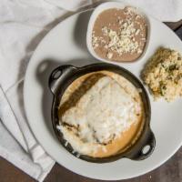 Meatloaf · Ground beef, chorizo, sausage, sautéed onions, topped with oaxaca cream sauce.
