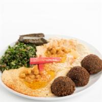 Veggie Plate · Hummus, baba ganoush, tabbouleh, grape leaves, falafel served with pita bread.