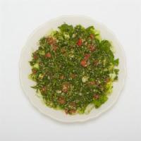 Tabouleh Salad · A salad made from cracked wheat, diced tomatoes, parsley, onion, olive oil and lemon juice.