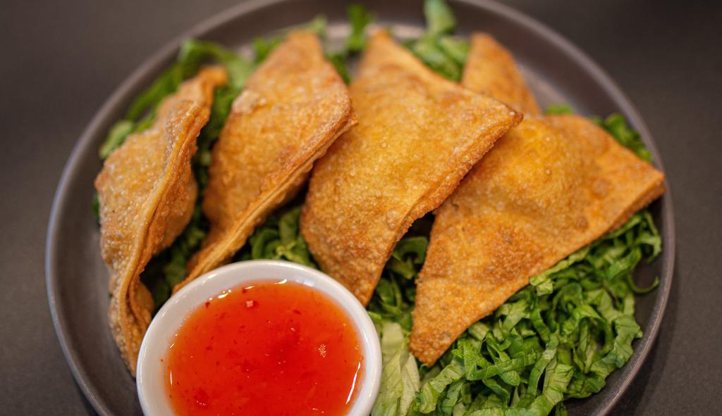 Crab Rangoon · Pho Real Kitchen and Bar favorite: Choice of traditional or jalapeño garlic. Fried wonton filled with cream cheese with a side of sweet and sour sauce.