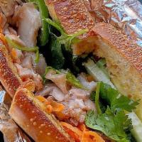 Banh Mi · Toasted French bread filled pâté spread with pork belly meats, cucumbers, cilantro, pickled ...
