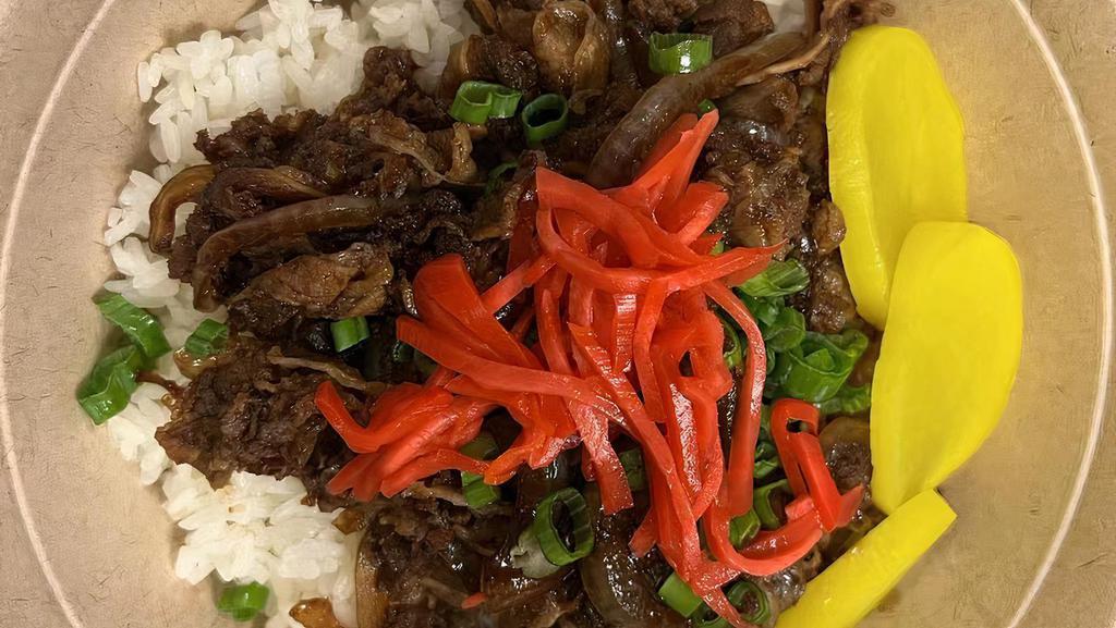 Gyu Don · Thinly sliced fatty beef, cooked in a slightly sweet mixture of mirin and soy sauce with sliced onions over steamed rice, sliced pickled ginger and sliced pickled radish, fresh chopped scallion.
