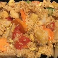 Pineapple Fried Rice · Vegan. Thai style fried rice with white onion, pineapple, tomato, and egg in tangy sauce.
