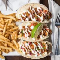 Spicy Shrimp Tacos · Three soft shell tortillas, spicy flash-fried shrimp, slashed napa cabbage, red onion, scall...