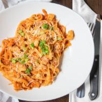 Cajun Fettuccine · We are bringing back a classic! “our home-made Cajun sauce” tossed with tender sauteed chick...