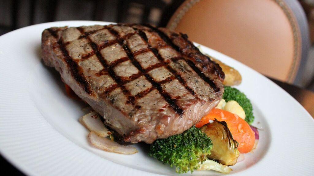 Grilled Ribeye · 14 oz. ribeye grilled to your specifications served with roasted yukon potatoes and seasonal vegetables.