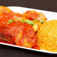 Braised Goat Shank Meal · Slowly braised goat shank, dipped in stew sauce and served over your choice of jollof, fried...