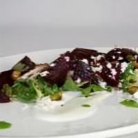 Heirloom Beet Salad · Pistachios and goat cheese mousse.