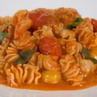 Shrimp Marinara · Radiatore pasta, blistered tomatoes, garlic, chili flake, house marinara, and basil.