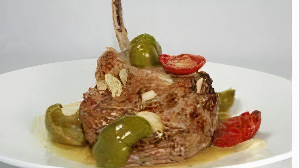 Veal Chop · Pan seared veal chop, roasted garlic potatoes, and hot and sweet cherry peppers.