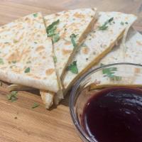 Quesadilla · served with a blueberry reduction sauce