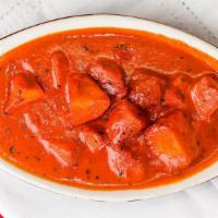 Butter Chicken (Boneless) · a mild tomato curry spiced with cinnamon, cardamom
and cloves and finished with butter