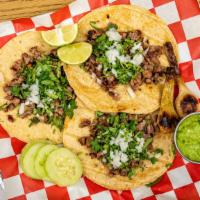 Tacos · Tortilla de harina o maíz, cebolla y cilantro. / Flour or corn tortilla, onion and cilantro.