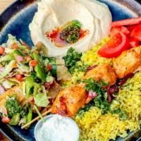 Combo 1 · One chicken kabob served over rice with hommous and fattoush. Served with pita bread.