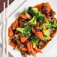 Broccoli Beef · Stir-fried beef with fresh crisp broccoli florets and carrots, in our brown sauce.