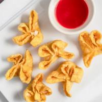 Crab Rangoon (6) · A blend of cream cheese and crabmeat stuffed into wonton wraps and fried crisp.