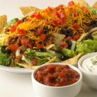 Taco Salad · Lettuce, tomatoes, onions, black olives, taco meat, cheddar cheese and tortilla chips (salsa...